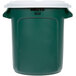 A green Rubbermaid BRUTE recycling can with a white lid.