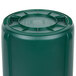 A green Rubbermaid BRUTE plastic container with a white lid.