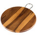 A Tablecraft round acacia wood display board with a brushed nickel handle.