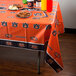 An Auburn University table cover with orange and white stripes on a rectangular table.