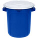 A blue Rubbermaid BRUTE plastic recycling can with white lid.