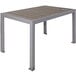 A BFM Seating metal table with a gray synthetic teak top on a patio.