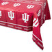 A red Creative Converting Indiana University plastic table cover with white logos and writing on it.