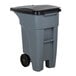 A Rubbermaid grey rectangular trash can with black lid and wheels.