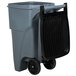 A Rubbermaid grey rectangular trash can with black wheels and a black lid.