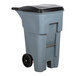 A grey Rubbermaid wheeled rectangular trash can.