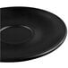 A Libbey Driftstone Onyx Satin Matte porcelain saucer with a black surface.