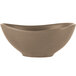 A close-up of a Libbey Driftstone sand satin porcelain bowl with a curved shape.
