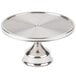 A Cal-Mil stainless steel cake stand with a round base on a table.