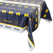 A University of Michigan plastic table cover with a logo on a table.
