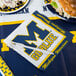 A University of Michigan napkin with a fork on it.