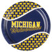 A University of Michigan paper plate with a blue and yellow logo on it.