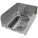 An Advance Tabco stainless steel drop-in sink splash wrap installed on a counter with a faucet.