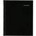 A black DayMinder hardcover monthly planner with white text on the cover.