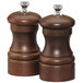 A close-up of a Chef Specialties walnut salt and pepper mill set with silver knobs.