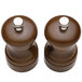 A Chef Specialties walnut pepper mill and salt mill set with silver buttons.