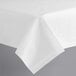 A Hoffmaster white linen-like table cover on a table.