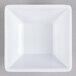 A white square Elite Global Solutions melamine bowl.