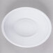 An Elite Global Solutions white melamine bowl with a swirl pattern.