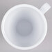 A white Elite Global Solutions Swirl melamine mug with a handle.
