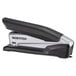 A grey and black Bostitch PaperPro 1100 inPOWER stapler on a table.