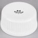 A white plastic lid with the word "Tuxton" on it.