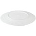 An off white irregular oval melamine serving dish with a circular pattern on it.