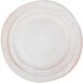 An off white Elite Global Solutions Della Terra melamine plate with a circular rim.