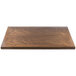 A BFM Seating Autumn Ash veneer wood table top with a wooden surface.