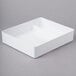 A white rectangular melamine tray with two compartments.