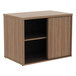 A walnut Alera low storage cabinet with an open door and a shelf inside.