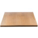 A close-up of a BFM Seating natural ash veneer table top with a wooden surface.