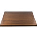 A BFM Seating square wooden table top with a brown finish.