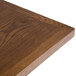 A close up of a BFM Seating Autumn Ash Veneer table top.