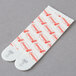 A pair of white 3M Command plastic strips with red and white text on them.