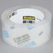 A roll of 3M Scotch heavy-duty clear shipping tape with the word "shipping" on it.