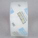 A roll of 3M Scotch heavy-duty clear packaging tape with blue and black labels.