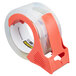 A 3M Scotch heavy-duty packaging tape roll with a red dispenser.