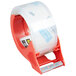 A roll of 3M Scotch heavy-duty packaging tape with a red dispenser handle.