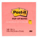 A pink square 3M Post-It note pad with yellow and black text.