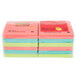 A plastic wrapped stack of 3M Post-It notes in assorted neon colors.