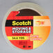 A roll of 3M Scotch clear moving and storage tape with a red and yellow label.