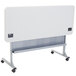 A speckled gray NPS plastic flip top table on wheels.