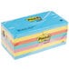 A stack of 14 3M Post-It note pads in assorted colors.
