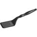 A black slotted spatula with a handle.