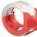 A roll of 3M Scotch clear packaging tape in a red tape dispenser.