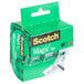 A green 3M Scotch Magic tape package with clear tape dispensers inside.