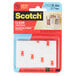 A package of 3M Scotch clear mounting strips.