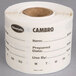 A white Cambro dissolvable product label roll on a counter.