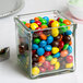 A Cal-Mil square glass container filled with colorful candy.